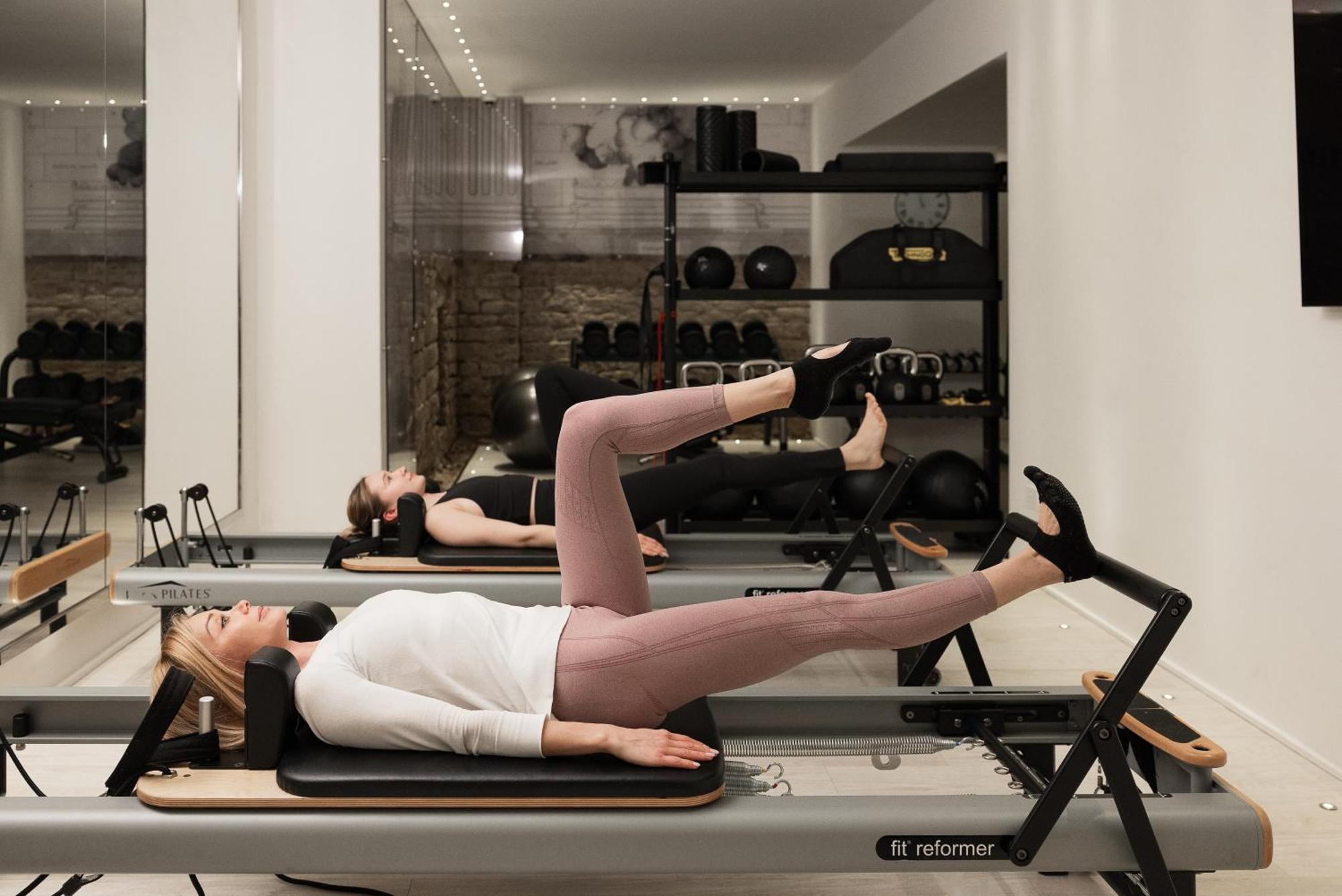 Helvetia&Bristol Firenze - Starhotels Collezione Bagian luar foto A woman using a Pilates reformer